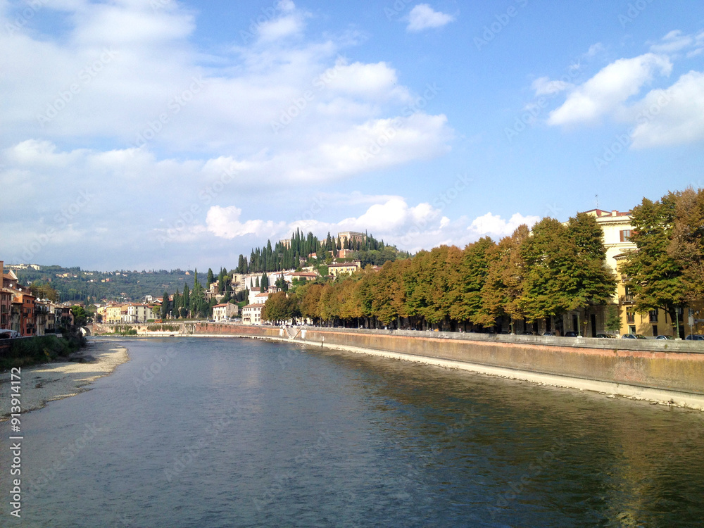 View of Verona, Italy in autumn from a bridge over the Adige River View of Verona, Italy in autumn from a bridge over the Adige River