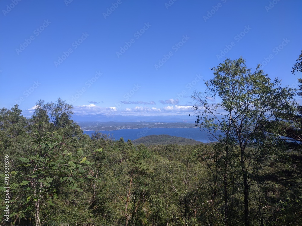 Enjoy the stunning coastal view, surrounded by water and islands, captured in an aerial shot