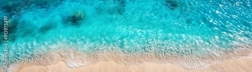 Ocean Meets Sand Top view of crystal clear turquoise water and beach