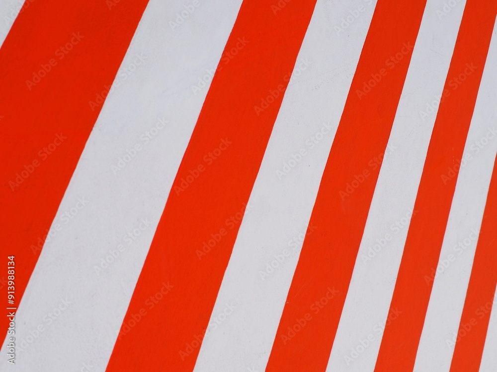 Red and white striped wall. The cement walls are painted in white and red with vertical patterns. Red white stripes park stop marking. White and red old cement floor texture for background.
Red and white striped wall. The cement walls are painted in white and red with vertical patterns. Red white stripes park stop marking. White and red old cement floor texture for background.