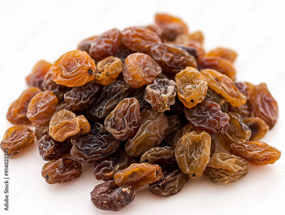 Dried Raisins Piled Together on a White Surface During Bright Daylight Dried Raisins Piled Together on a White Surface During Bright Daylight