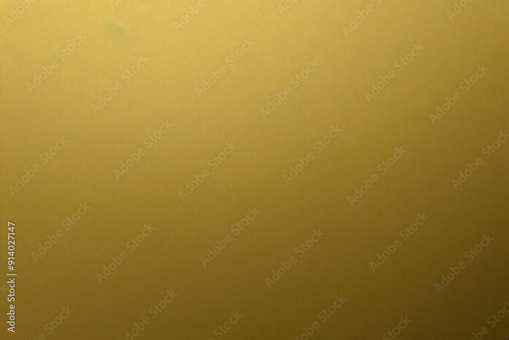 Glowing gold foil metal panel wall with copy space, abstract texture background Glowing gold foil metal panel wall with copy space, abstract texture background