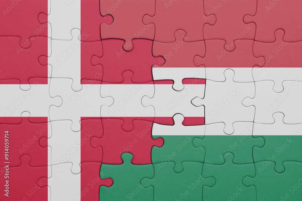 puzzle with the colourful national flag of hungary and flag of denmark. puzzle with the colourful national flag of hungary and flag of denmark.