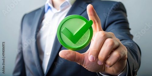 Approval and quality assurance concept represented by a hand holding a check mark icon, symbolizing top-notch service, exceptional product performance, and industry-leading certification standards. photo
