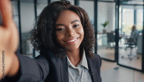Free Download  Smiling businesswoman taking a selfie in the office  - GFXLoad