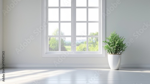 Bright and airy interior featuring a large window and a green plant in a modern pot, perfect for home decor inspiration.