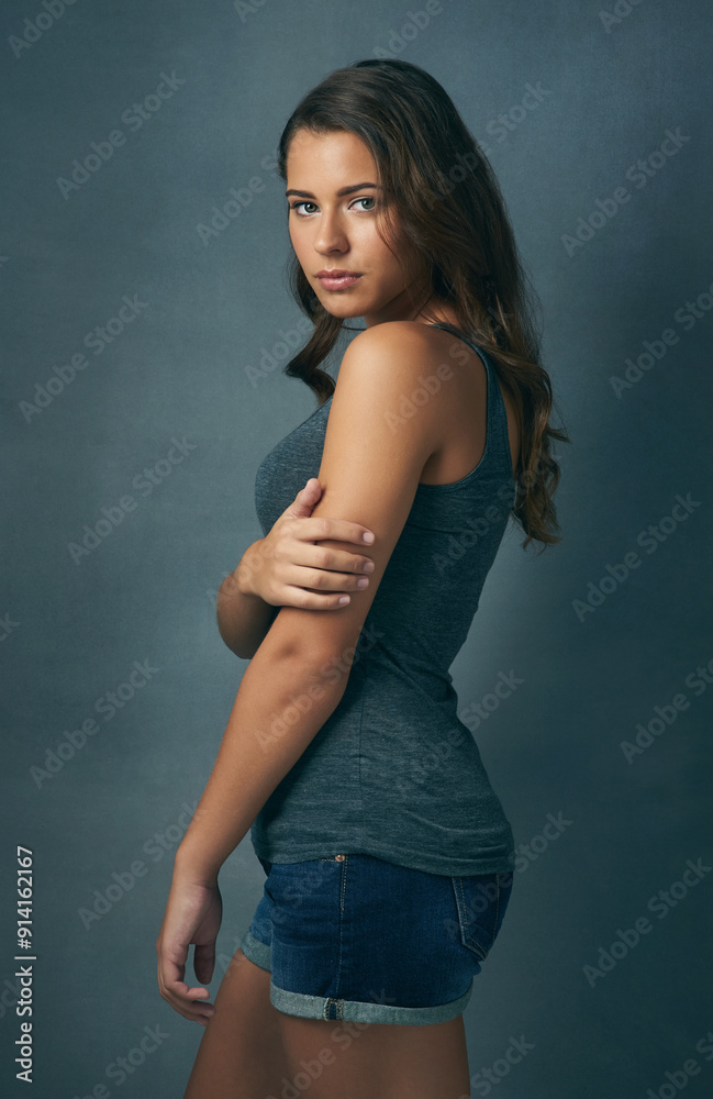 Hair care, salon and portrait of woman in studio with volume, collagen and beauty treatment. Cosmetic, health and female person with hairstyle for shiny, long and curly routine by blue background. Hair care, salon and portrait of woman in studio with volume, collagen and beauty treatment. Cosmetic, health and female person with hairstyle for shiny, long and curly routine by blue background.