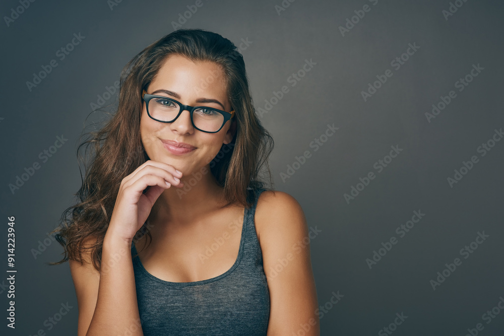 Portrait, woman and thinking with glasses in studio for space, eye care and lens opinion of prescription frame. Smile, girl and designer eyewear for consultation, ophthalmology and grey background Portrait, woman and thinking with glasses in studio for space, eye care and lens opinion of prescription frame. Smile, girl and designer eyewear for consultation, ophthalmology and grey background