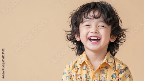 Smiling Cute Child in Colorful Shirt. photo