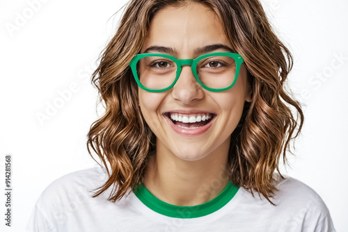 Portrait of a young woman with green glasses smiling