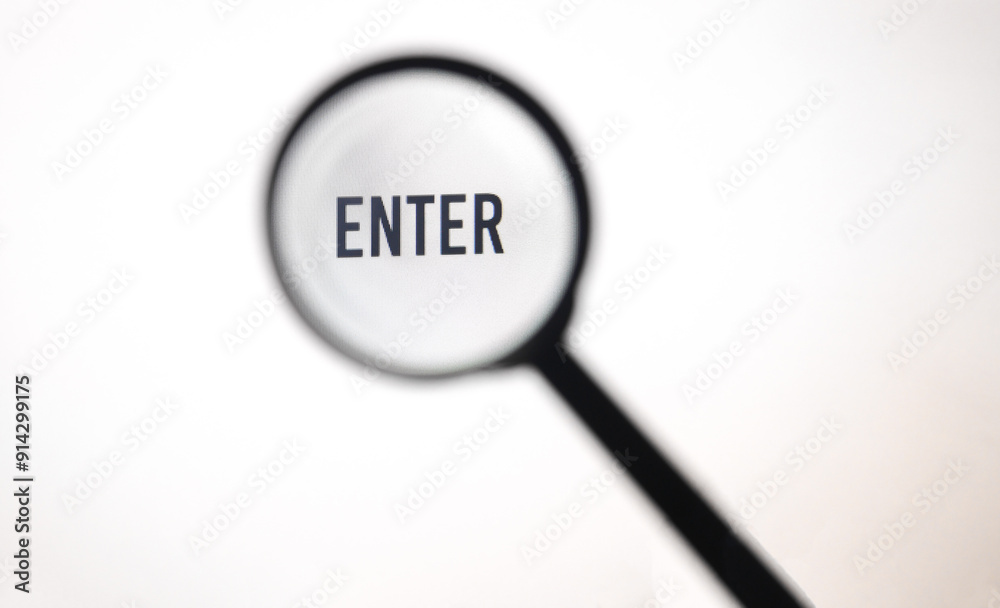 Word enter on screen through magnifying glass close-up Word enter on screen through magnifying glass close-up