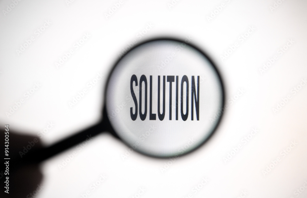 Word solution on screen through magnifying glass close-up Word solution on screen through magnifying glass close-up