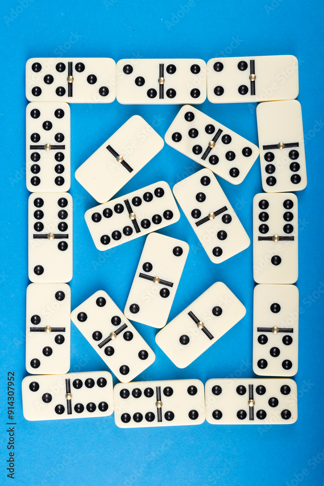 Connected dominoes on a blue background. Connected dominoes on a blue background.