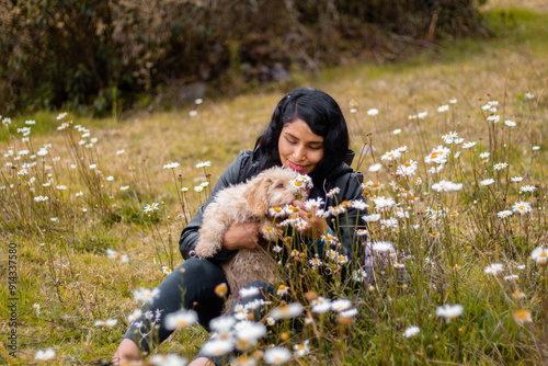 Young woman using mobile phone isolated on flowers nature background during advertising and facial expression .communication chat with cell phone. photo