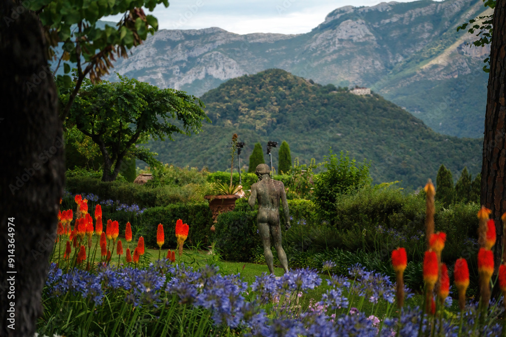 Scenic Mountain Garden with Vibrant Flowers and Stone Statue, Terrace of Infinity, Gardens of Villa Cimbrone villa in ravello