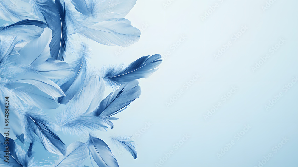 A cluster of delicate, wispy feathers in various shades of blue. A cluster of delicate, wispy feathers in various shades of blue.