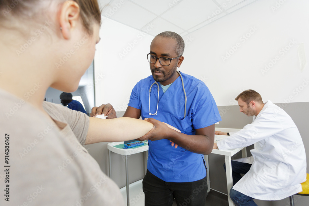 doctor wipe arm before an injection doctor wipe arm before an injection