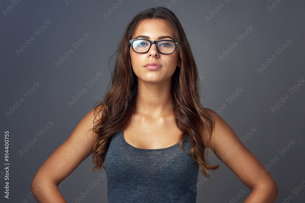 Eye care, woman and portrait on studio for confidence, attitude and designer optometry brand. Female person, glasses and assertive on dark background for prescription lens, new frames and aesthetic Eye care, woman and portrait on studio for confidence, attitude and designer optometry brand. Female person, glasses and assertive on dark background for prescription lens, new frames and aesthetic