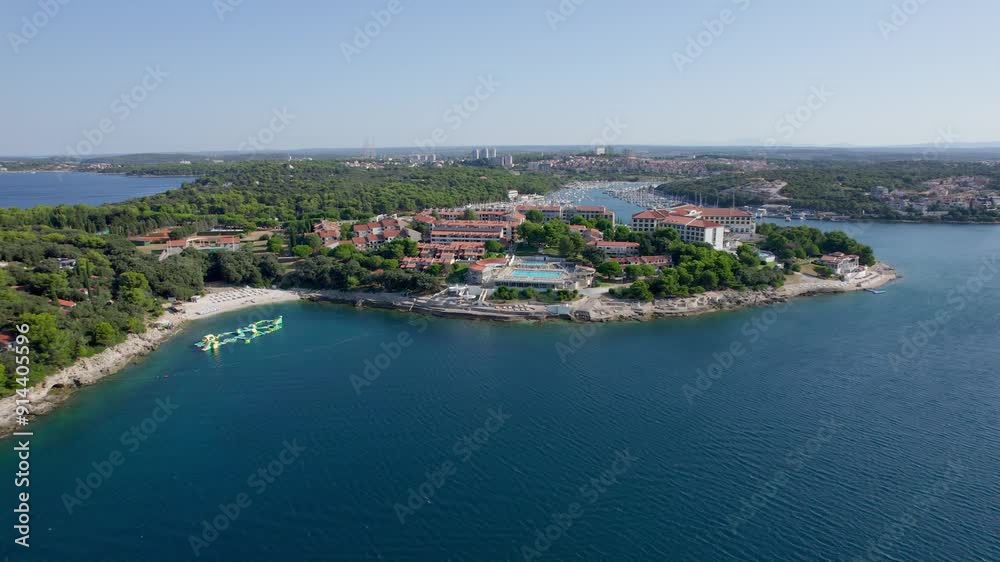 A stunning view captured by drone along the shores of the Mediterranean Sea. The beautiful Croatian coast during a summer vacation, with boats and yachts slicing through the sea waters. A stunning view captured by drone along the shores of the Mediterranean Sea. The beautiful Croatian coast during a summer vacation, with boats and yachts slicing through the sea waters.