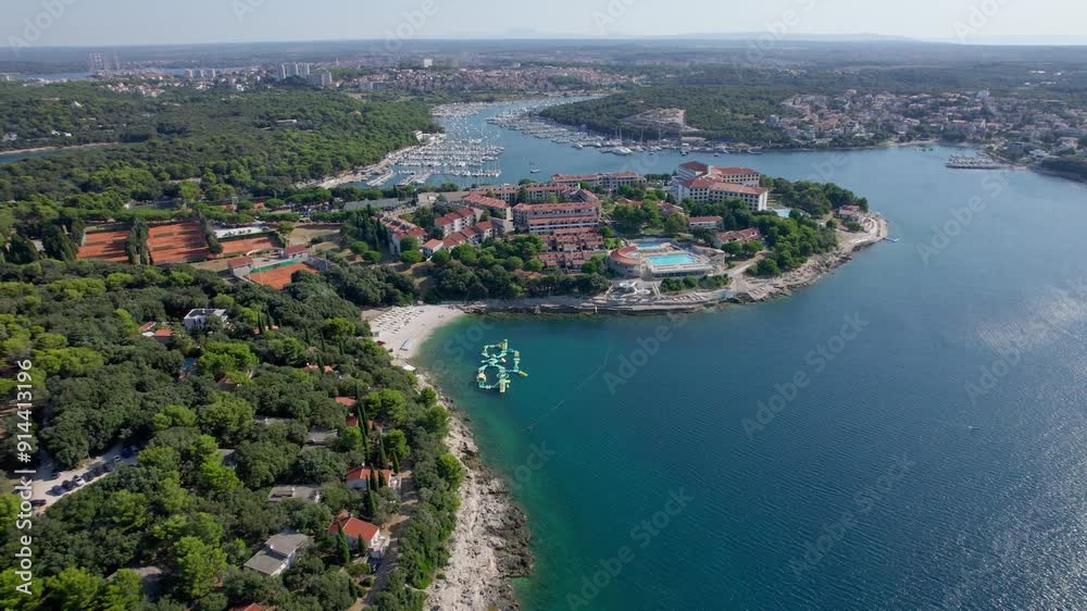 A stunning view captured by drone along the shores of the Mediterranean Sea. The beautiful Croatian coast during a summer vacation, with boats and yachts slicing through the sea waters. A stunning view captured by drone along the shores of the Mediterranean Sea. The beautiful Croatian coast during a summer vacation, with boats and yachts slicing through the sea waters.