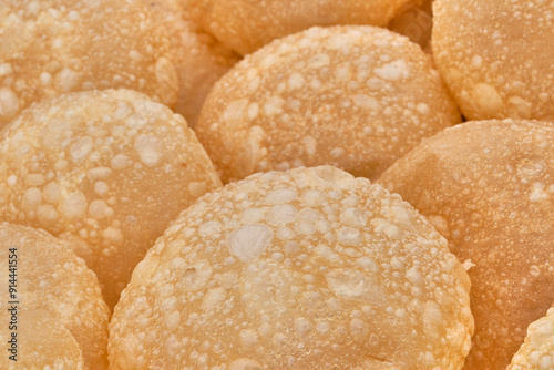 Texture of baursaks of Siberian Tatars, pieces of dough, fried in deep fat. photo