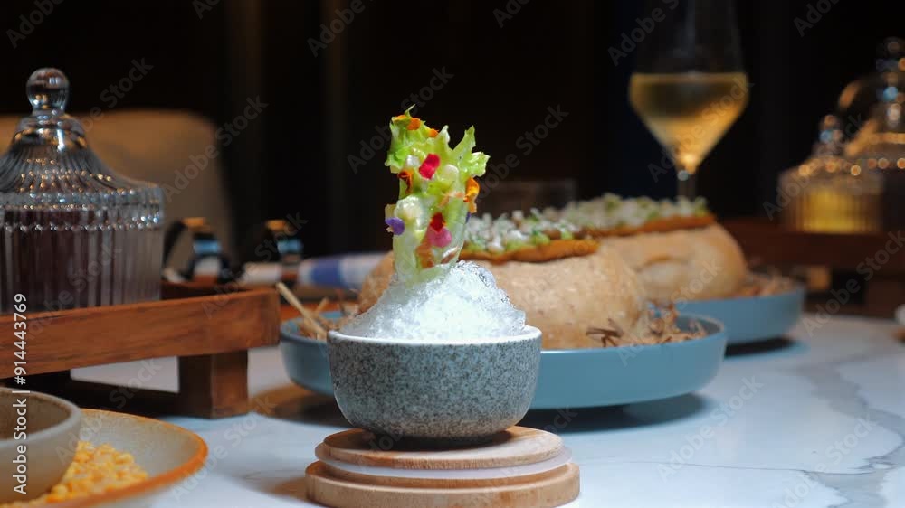 Gourmet dining setup featuring assortment of elegant dishes, beautifully plated on marble table, with glass of white wine in background. Fine Dining and Culinary Art.