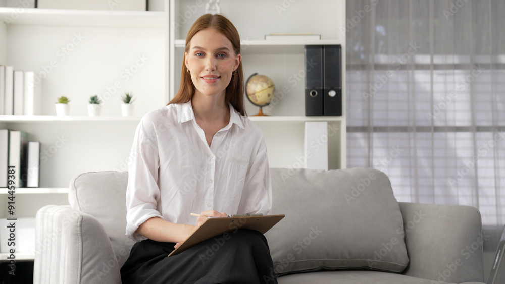Friendly psychologist woman in clinic office professional portrait with smile and holding clipboard for patient to visit psychologist. The experienced and prim confident psychologist Friendly psychologist woman in clinic office professional portrait with smile and holding clipboard for patient to visit psychologist. The experienced and prim confident psychologist
