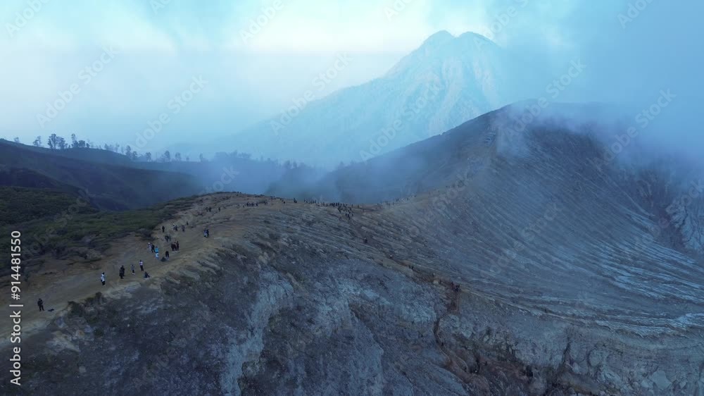 Ijen Volcano Caldera, flying along the border of Ijen Volcano in Java, view from a drone of the Ijen Volcano Caldera Ijen Volcano Caldera, flying along the border of Ijen Volcano in Java, view from a drone of the Ijen Volcano Caldera