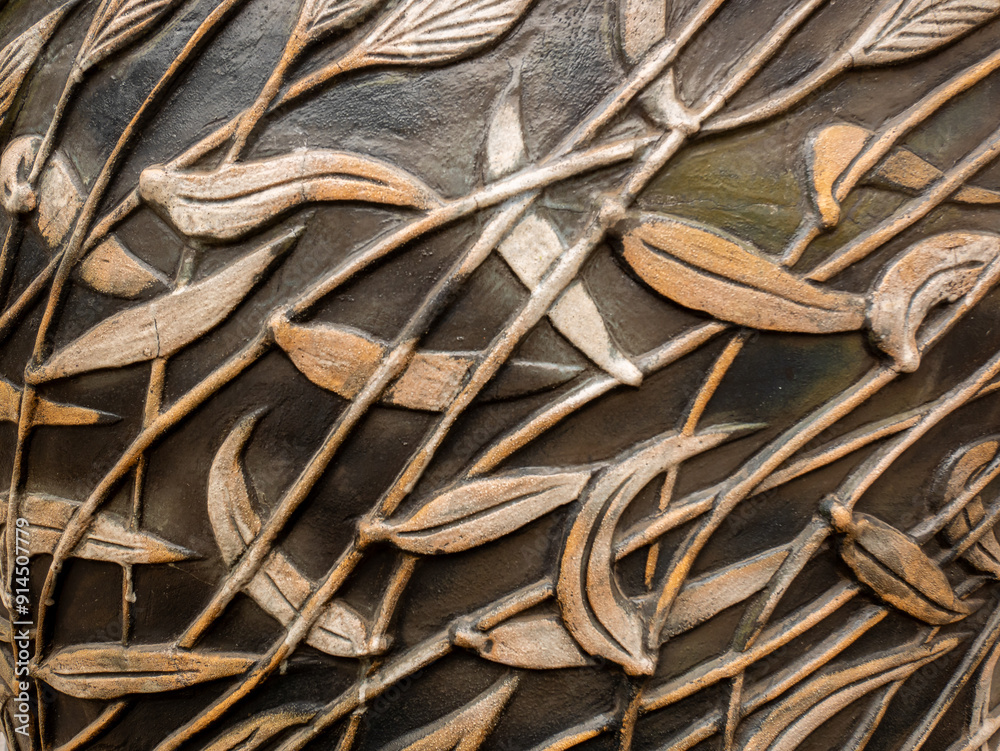 Background of Many Golden Leaves together in a Black Vase