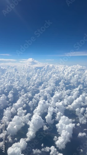 Aerial view of clouds at high altitude outside my airplane window  photo