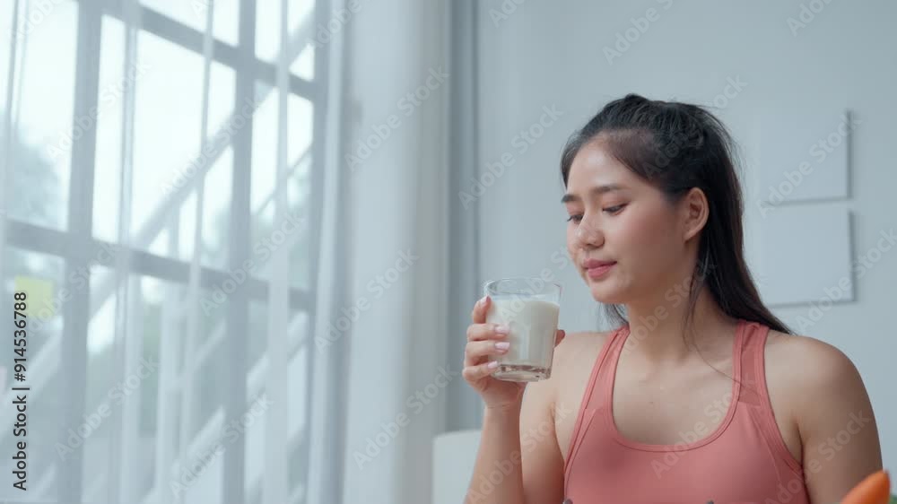 Woman enjoys fresh milk in a modern kitchen, surrounded by colorful vegetables. Promoting a healthy lifestyle and wellness Woman enjoys fresh milk in a modern kitchen, surrounded by colorful vegetables. Promoting a healthy lifestyle and wellness