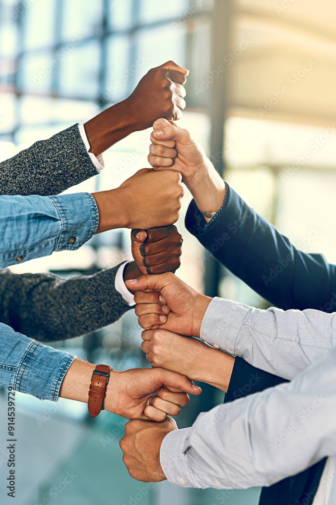 © JordaanExams/peopleimages.com - Business people, hands and fist stack with teamwork for employee solidarity, inclusion and equality in workplace. Diversity group, pile and collaboration for staff support, synergy and cooperation