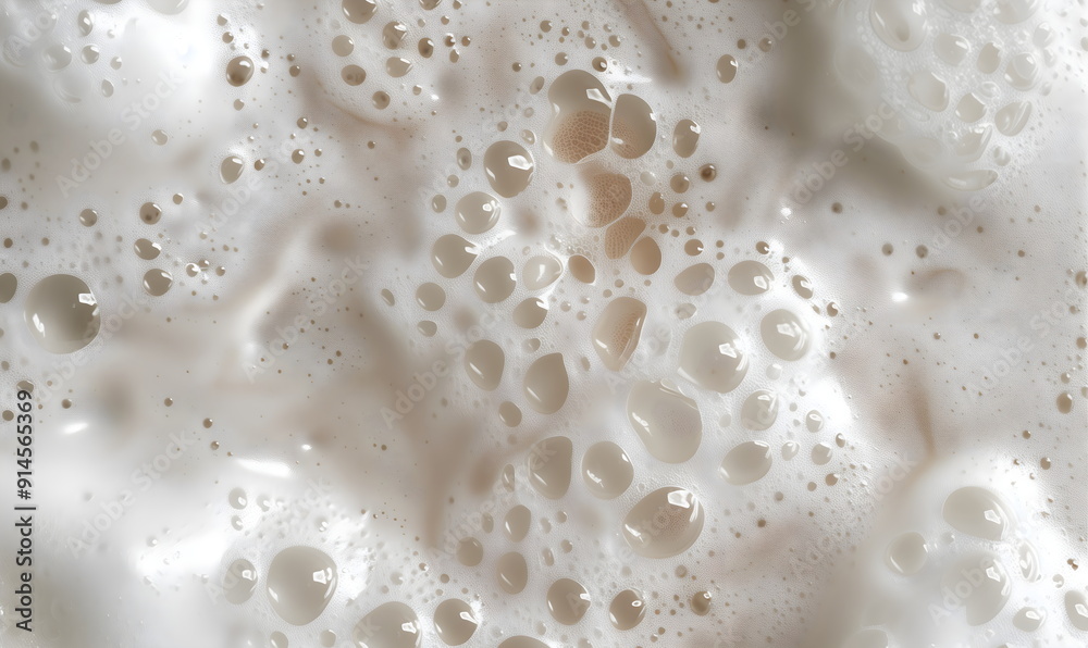 Abstract texture of whipped fresh milk cream, bubbles and milk rivers. Shampoo foam with bubbles. Confectionery or cosmetic banner Abstract texture of whipped fresh milk cream, bubbles and milk rivers. Shampoo foam with bubbles. Confectionery or cosmetic banner