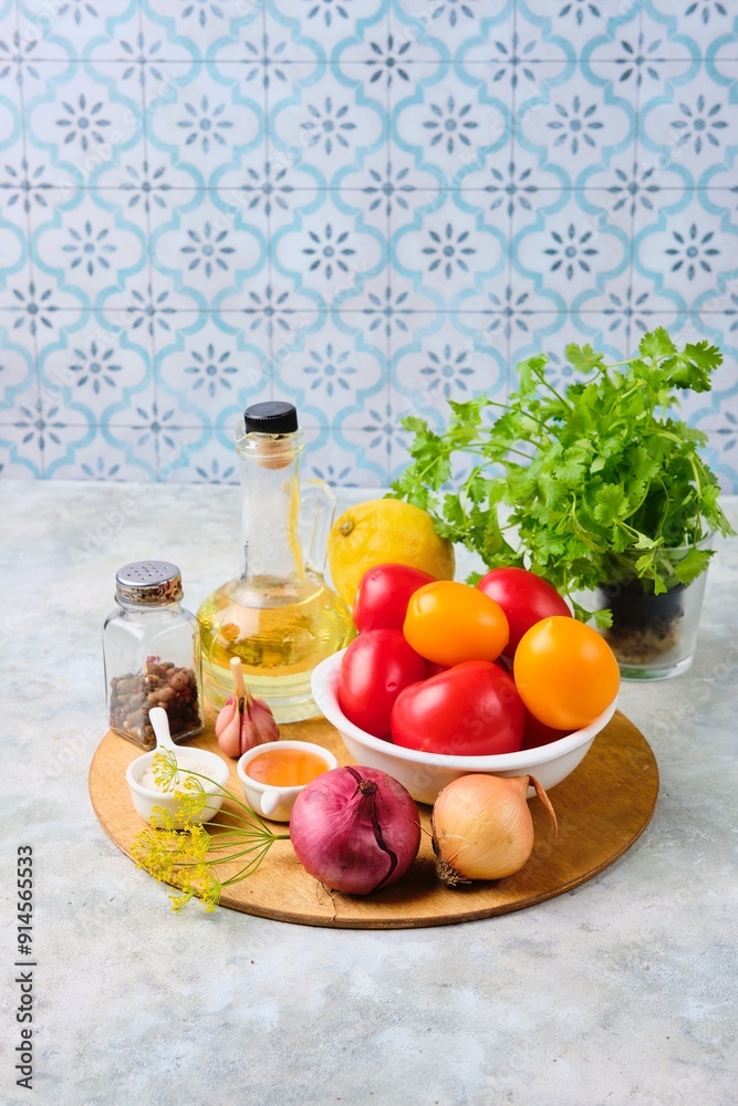Prepared ingredients for cooking fast pickled tomatoes with onions on a gray concrete background. Harvesting, conservation. Tomatoes recipes Prepared ingredients for cooking fast pickled tomatoes with onions on a gray concrete background. Harvesting, conservation. Tomatoes recipes