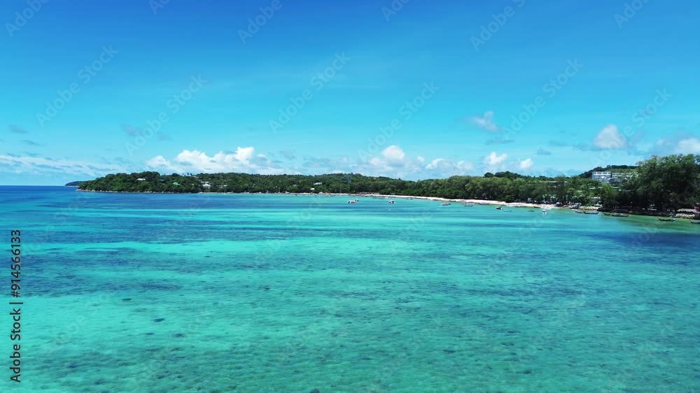 Flight over the beautiful shallow waters of Rawai Beach in the south of Phuket Flight over the beautiful shallow waters of Rawai Beach in the south of Phuket