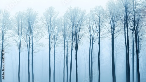 Misty Forest with Tall Bare Trees in Blue Tones