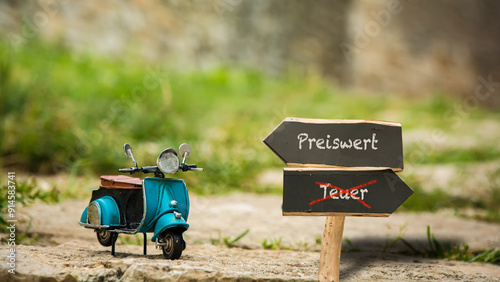 Fotografie Signposts the direct way to Inexpensive versus Expensive