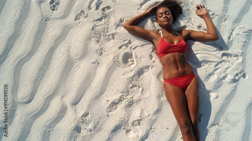Woman in Orange Bathing Suit Relaxing on Beach