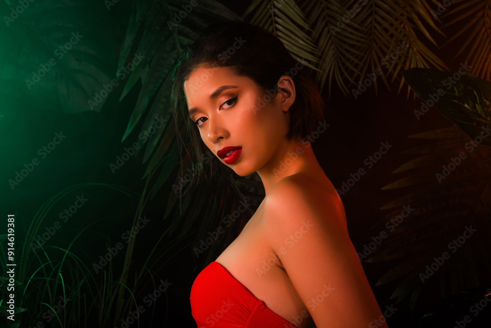 Photo of smiling shiny lady wear red swimsuit tacking exotic forest shower outdoors palms orange neon light