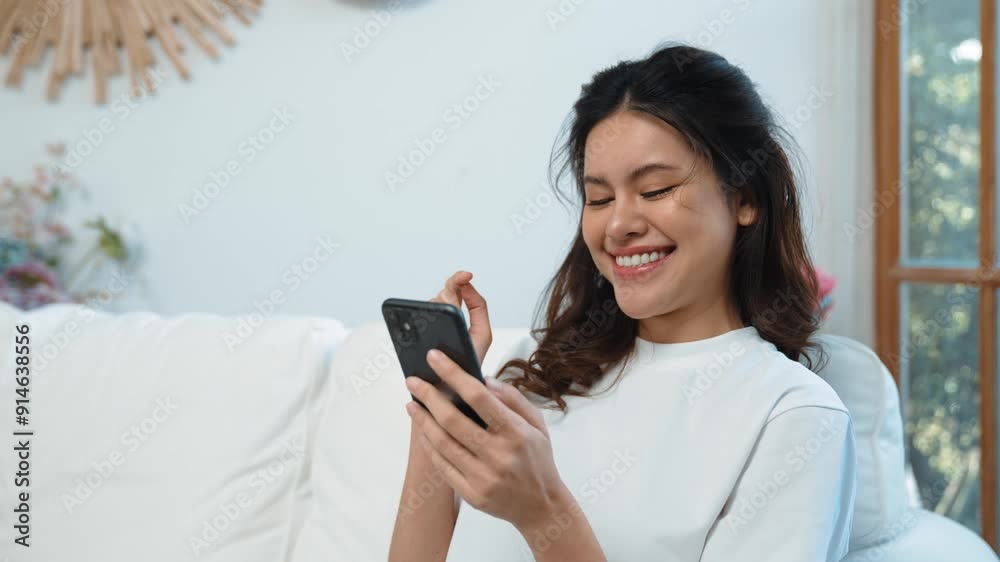 Young woman using smartphone browsing for online shopping E commerce by online payment gateway at vivancy home. Modern and convenience online purchasing make secure and convenient purchases. Young woman using smartphone browsing for online shopping E commerce by online payment gateway at vivancy home. Modern and convenience online purchasing make secure and convenient purchases.