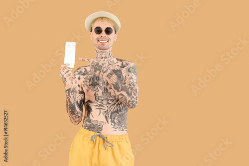 Tattooed man with sunscreen...