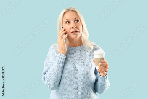Mature woman with takeaway ...