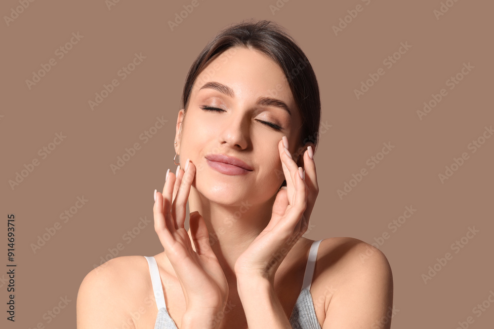 Beautiful young woman on brown background Beautiful young woman on brown background