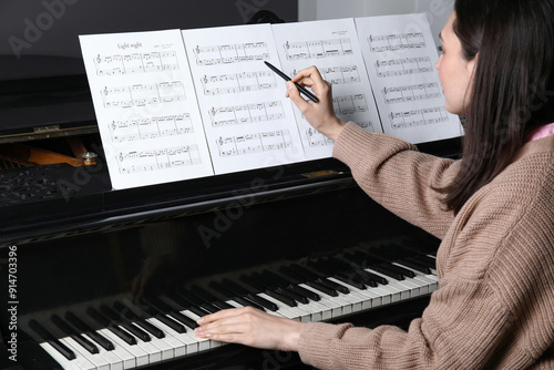 Young woman with note sheet...