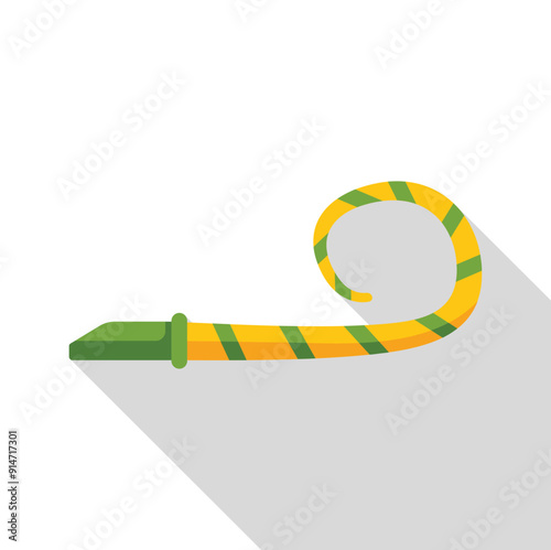 Green and yellow party blower unrolling to make noise at a birthday party