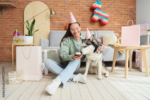 Young woman and cute husky ...