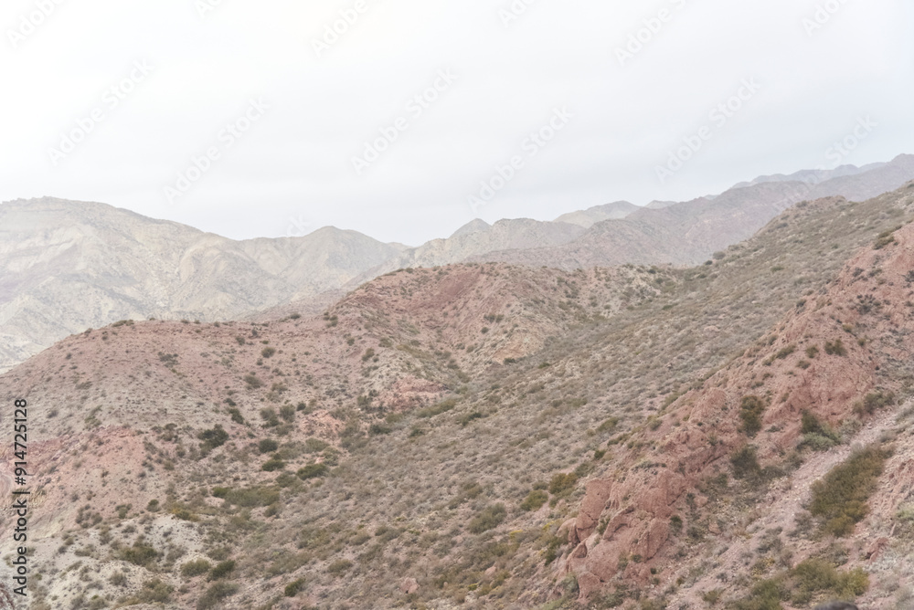 Andean misty scenery in the province of Mendoza, Argentina. The edge of the mountains can be seen through the fog. Andean misty scenery in the province of Mendoza, Argentina. The edge of the mountains can be seen through the fog.
