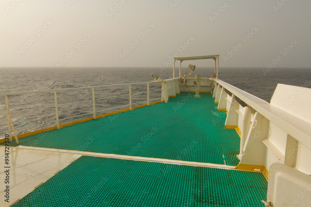 View of the bridge wing of a ship at sea View of the bridge wing of a ship at sea