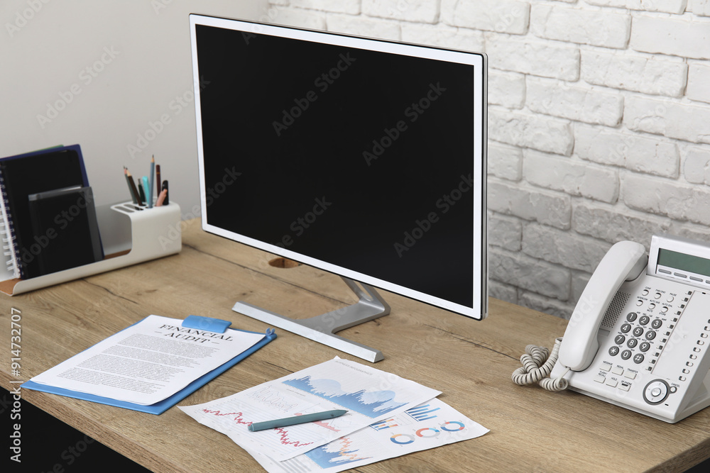 Workplace with modern computer, stationery and phone in stylish office Workplace with modern computer, stationery and phone in stylish office