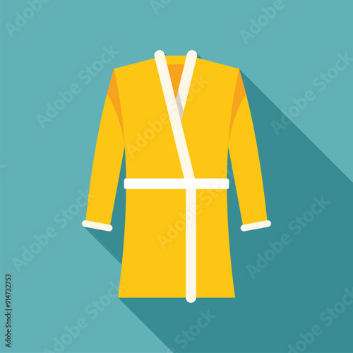 Yellow bathrobe hanging on wall, ready to provide comfort and relaxation at a spa or hotel